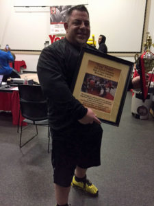 Tiny Meeker poses with his York Barbell Powerlifting Hall of Fame Award after being inducted November 20, 2016. Tiny also guest benched and broke the SHW Pro Equipped Men's Open Division bench press record with a 915 lb. bench.